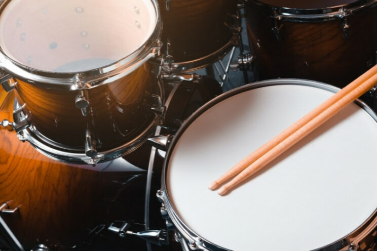 drum set with drumsticks on snare